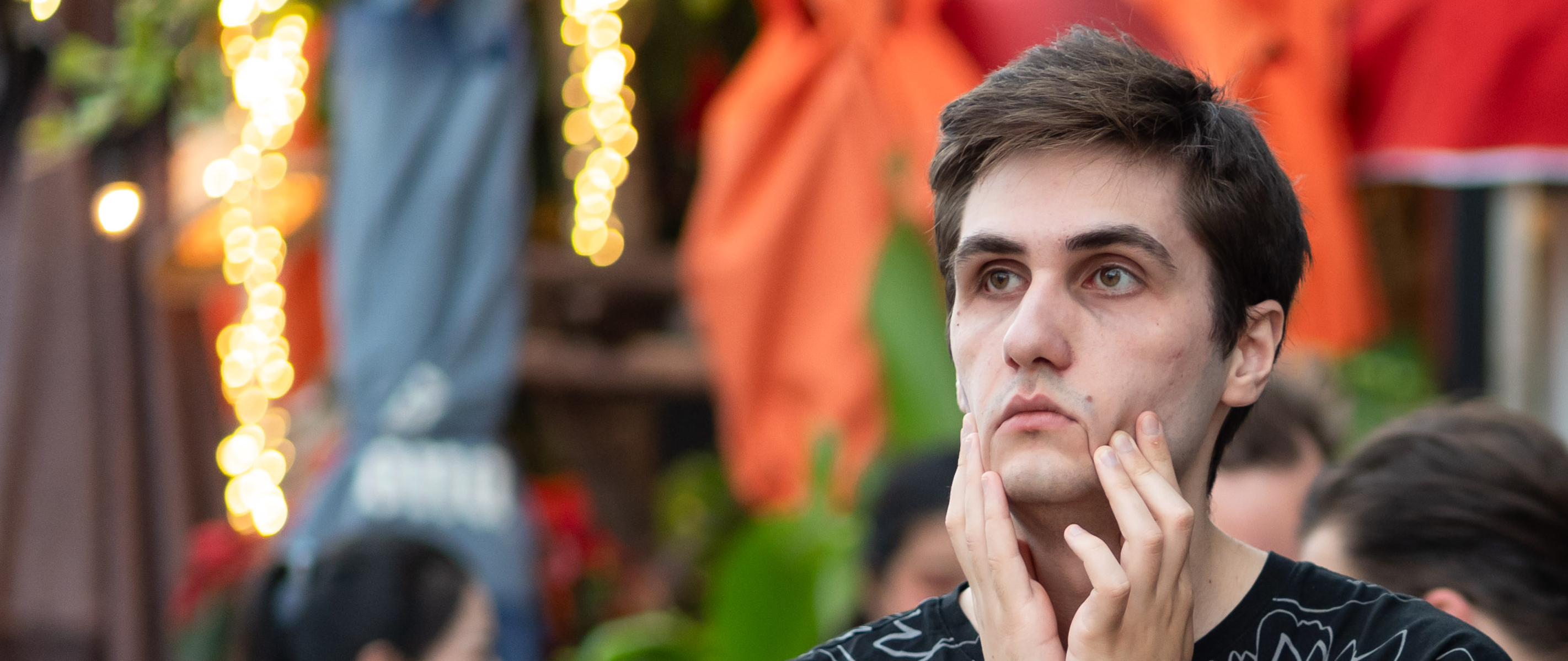 A photo of me, staring into a river in Bangkok, Thailand.